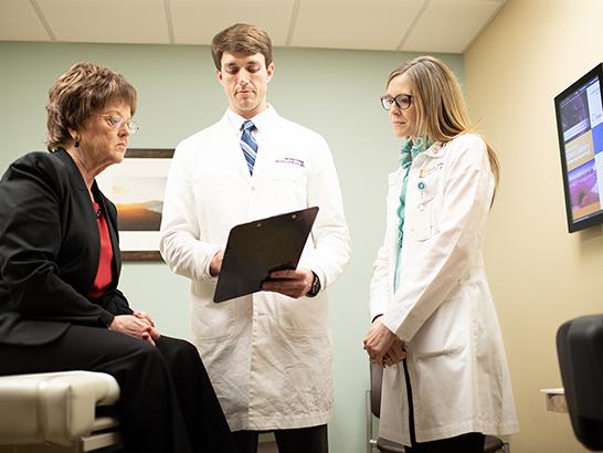 Two doctors with a patient