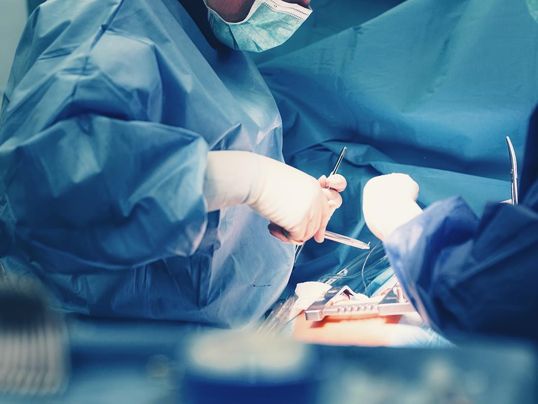 Surgeons operating on a patient