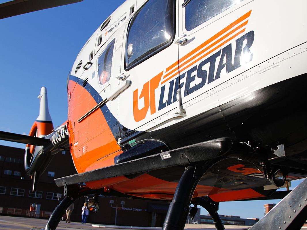 UT LIFESTAR helicopter on a landing pag