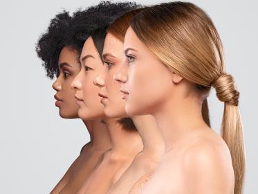 Four women of different races in profile