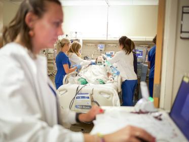 Nurses work in the TSICU