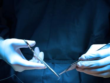 A surgeon's hands during surgery