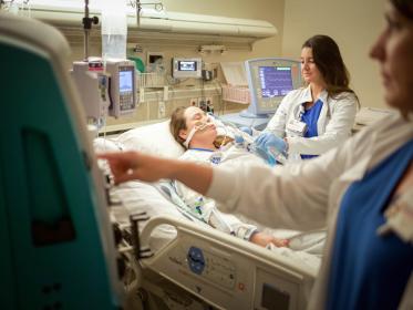 Team members work in the Medical Critical Care unit