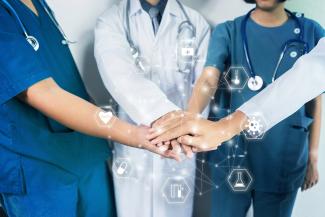 Doctors and nurses supporting each other