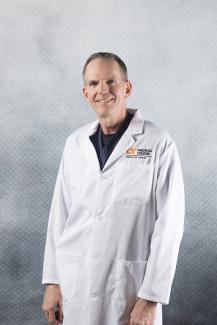 Douglas E. Holland, MD