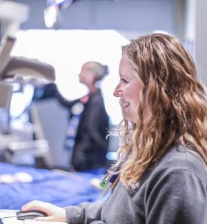 Two neuroscience nurses in a patient's room