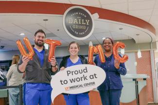New graduate nurses in front of hospital coffee shop