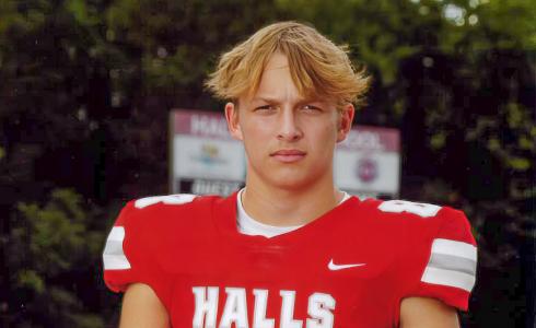 A high school football player in his football uniform